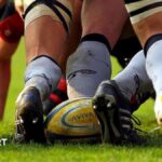 A rugby ball at the back of a scrum