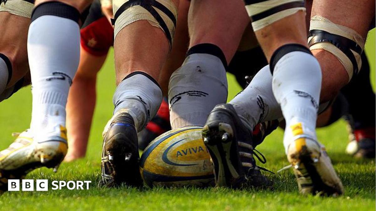 A rugby ball at the back of a scrum