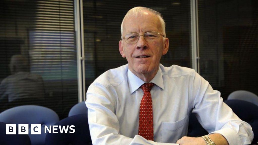 Sir Ian Wood in a shirt and tie, smiling