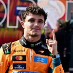 McLaren's Lando Norris holds up his left index finger in celebration after winning the Hungarian Grand Prix