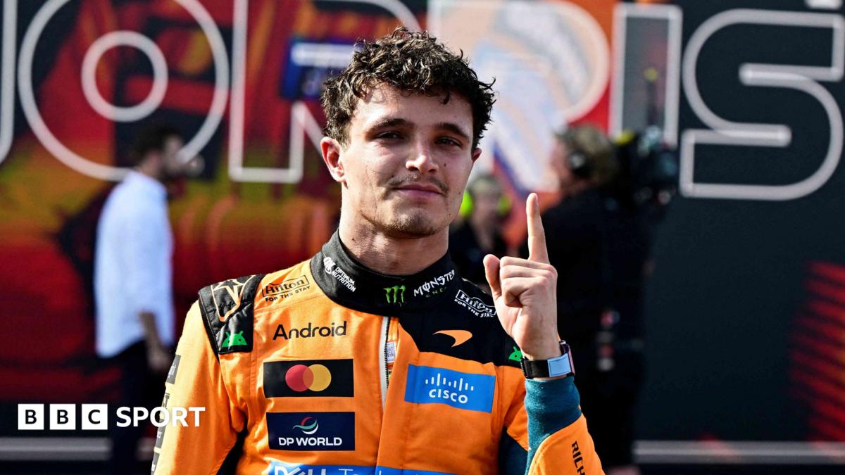 McLaren's Lando Norris holds up his left index finger in celebration after winning the Hungarian Grand Prix
