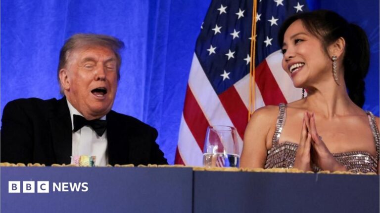 Trump reacts next to CBS News senior White House correspondent and White House Correspondents' Association President (WHCA)