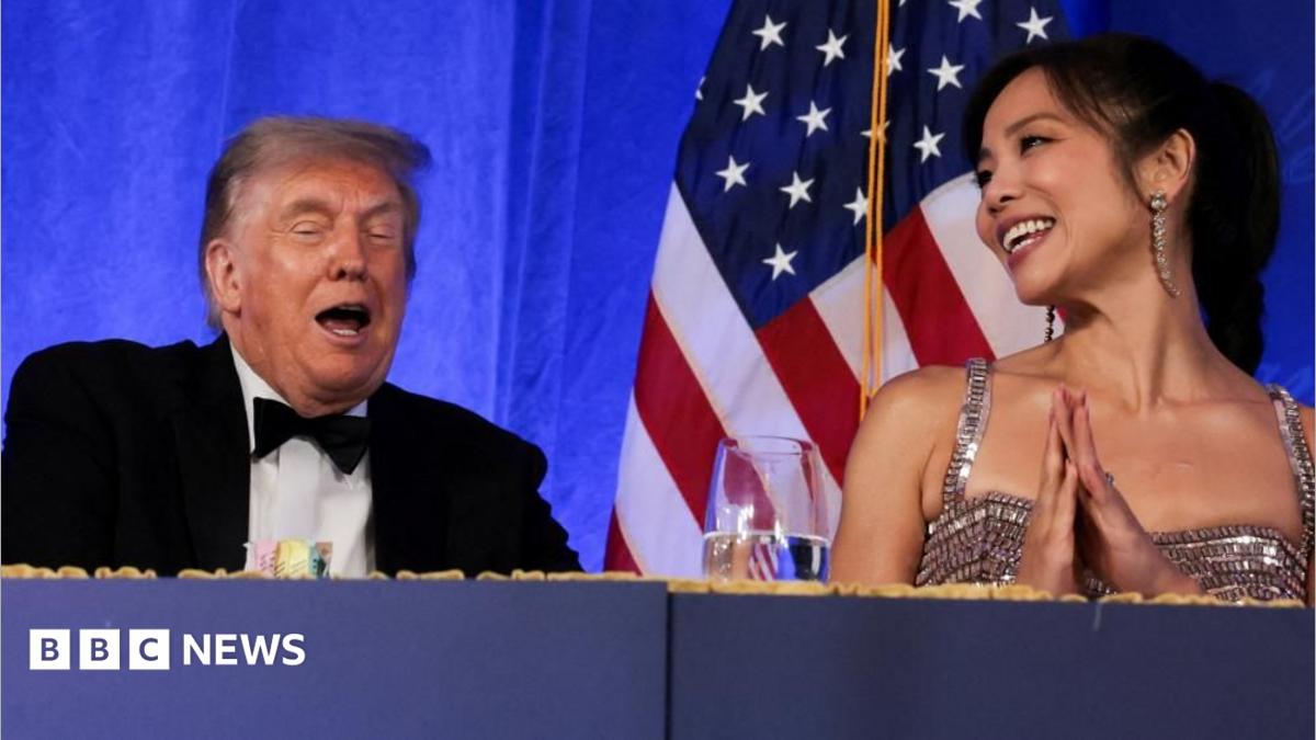Trump reacts next to CBS News senior White House correspondent and White House Correspondents' Association President (WHCA)