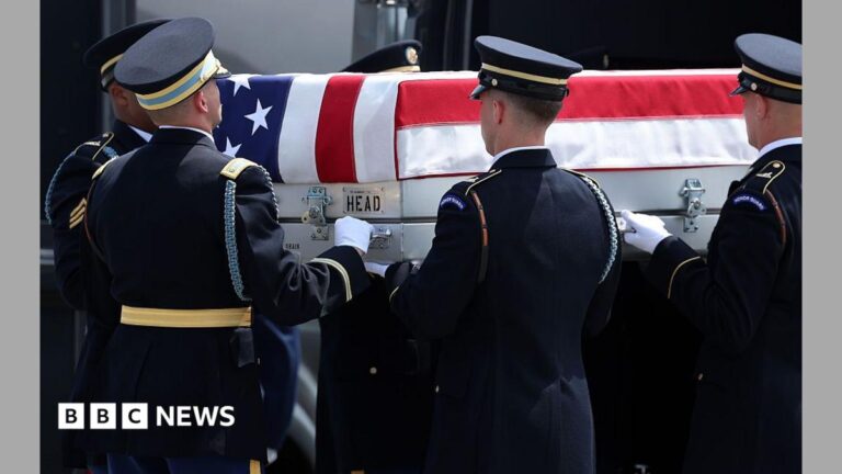 US soldiers carry a casket during a dignified transfer ceremony in Delaware in July