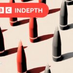 A treated image showing missiles coloured red and grey. They sit against a beige background