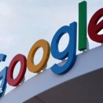 Google's primary-colored logo outside of a building