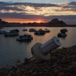 A formerly floating buoy now sits high and dry above Lake Powell