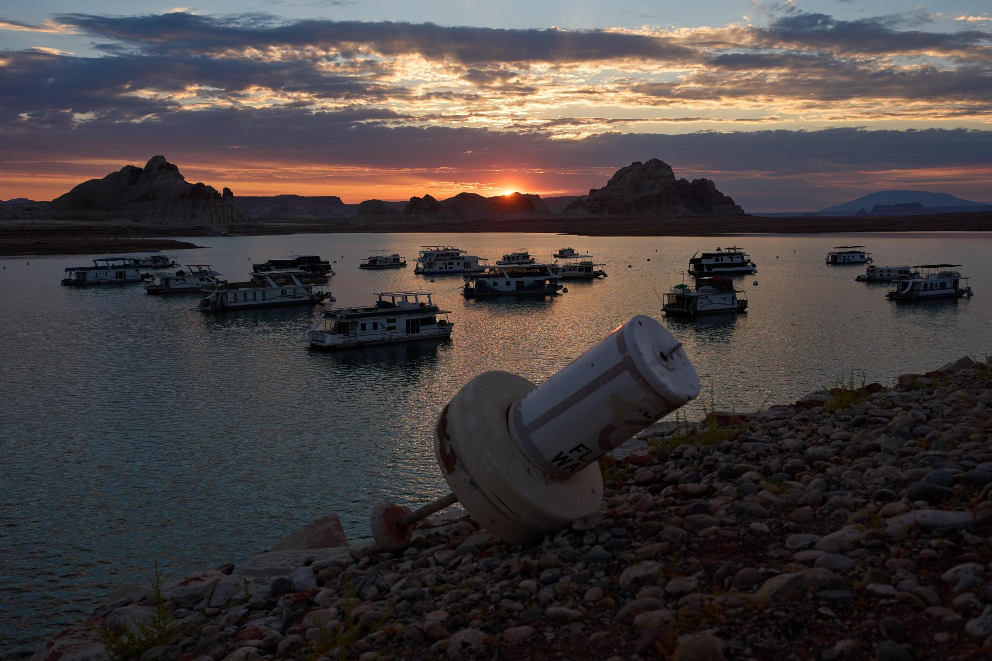 A formerly floating buoy now sits high and dry above Lake Powell