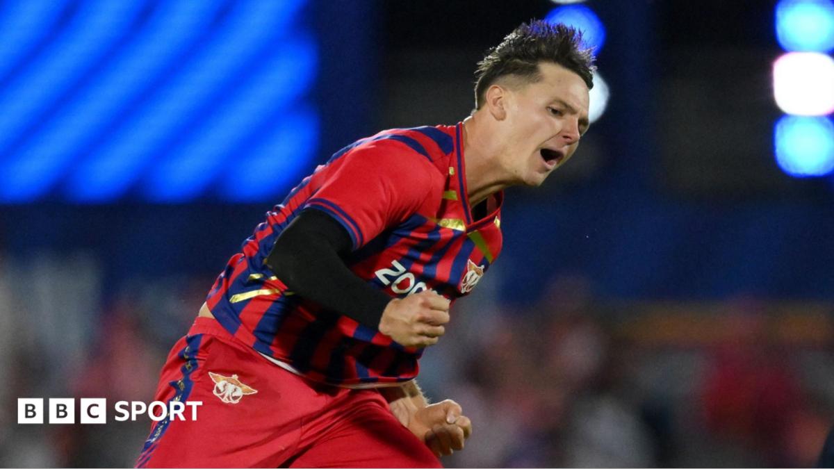 Sonny Baker of Manchester Super Giants, in the team's red and blue kit, celebrates a wicket