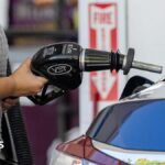 A driver refuels a vehicle at a Shell petrol station in Palo Alto, California, US