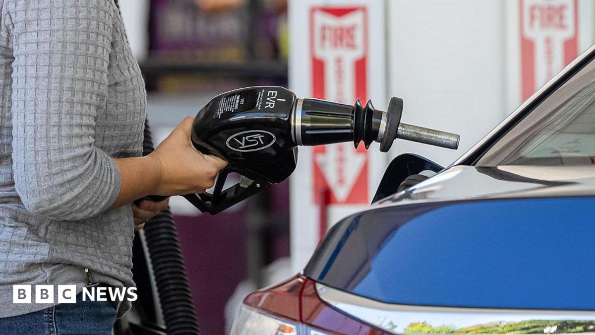 A driver refuels a vehicle at a Shell petrol station in Palo Alto, California, US