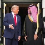 A file picture of Saudi Crown Prince Mohammed bin Salman and Donald Trump standing outside White House, behind them are two