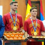 Spain midfielders Fabian Ruiz and Gavi holding a box of tomatoes on a visit back to the hometown of Los Palacios y