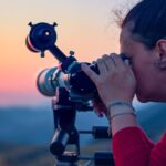 Woman using a solar telescope to look at the sun safely