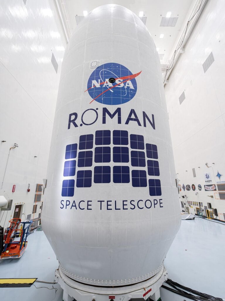 Close-up view of the Roman Space Telescope’s payload, wrapped in white covering with the NASA logo and Roman Space Telescope