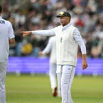 England captain Joe Root (R) speaks with Ollie Robinson during an innings and 103-run win over Pakistan in the first Test at