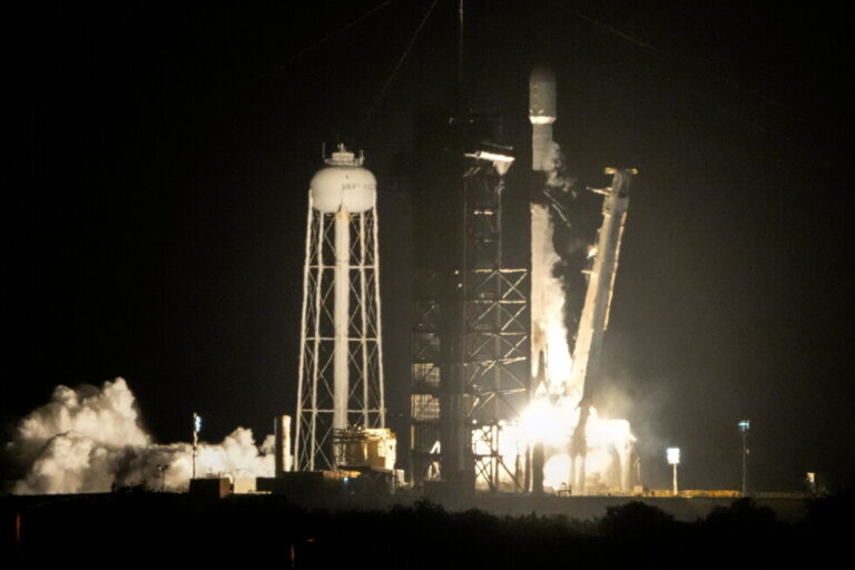 A SpaceX Falcon 9 rocket lifts off from pad 39A with a payload of a pair of lunar landers at the Kennedy Space Center in