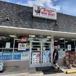 A customer walks into Beaver's Mini Mart in Beavercreek, Ohio, Friday, Aug. 14, 2026. (AP Photo/Julie Carr Smyth)