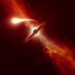 Illustration of a bright star stretched into a long thin stream of gas as it is pulled into a dark accretion disc around a