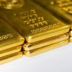 Gold prices retreated globally as the dollar rallied and Fed hike bets firm