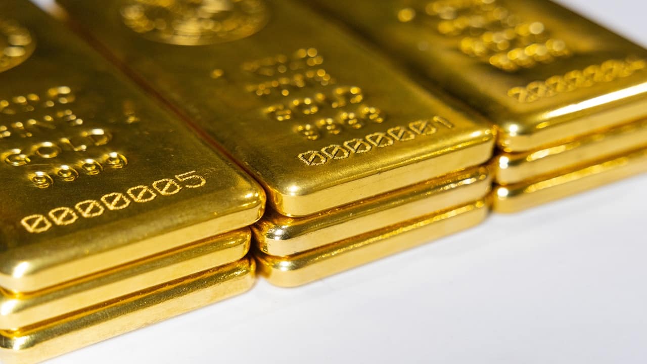 Gold prices retreated globally as the dollar rallied and Fed hike bets firm