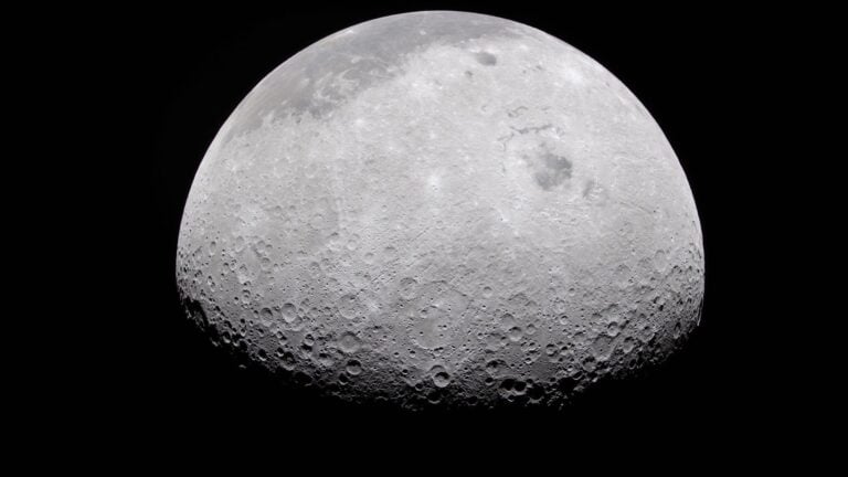 a grey, crater-marked orb on a black background
