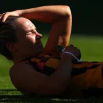 Emily Bates holds her head