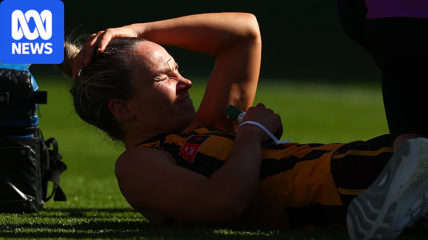 Emily Bates holds her head