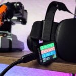 a Steam Frame on a shelf with a USB-C power monitor plugged in displaying 42 watts