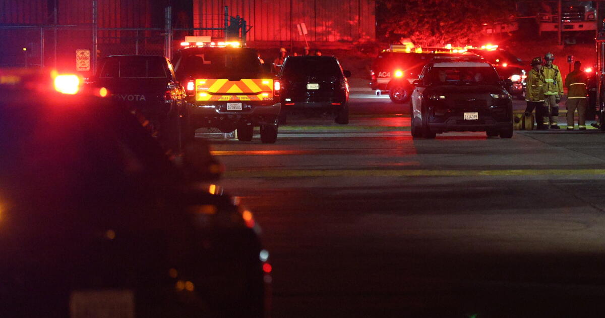 CHATSWORTH, CA - SEPTEMBER 15: Police investigate a helicopter crashed and burst into flames Tuesday night in Chatsworth not