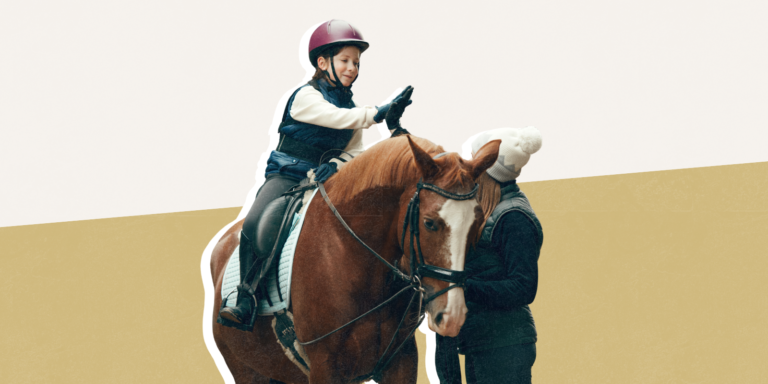 Child on a horse with instructor standing beside