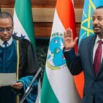 Ethiopia's Prime Minister Abiy Ahmed raises his right hand during his inauguration ceremony