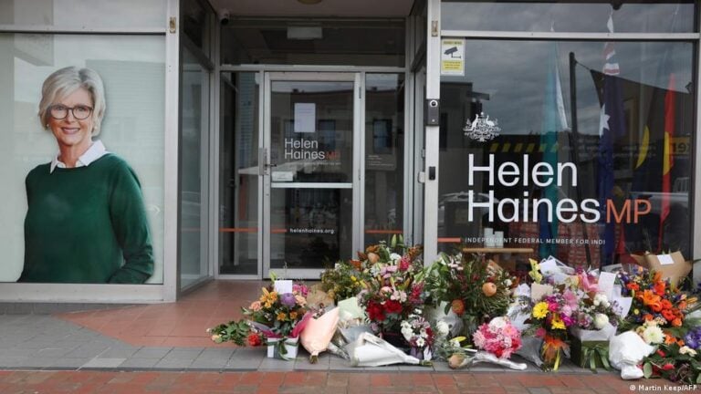 Floral tributes are placed outside the offices of Australian lawmaker Helen Haines who was critically wounded in a