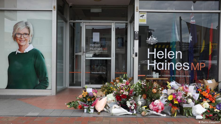 Floral tributes are placed outside the offices of Australian lawmaker Helen Haines who was critically wounded in a