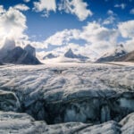 Image of sharp peaks sitting above a large glacier