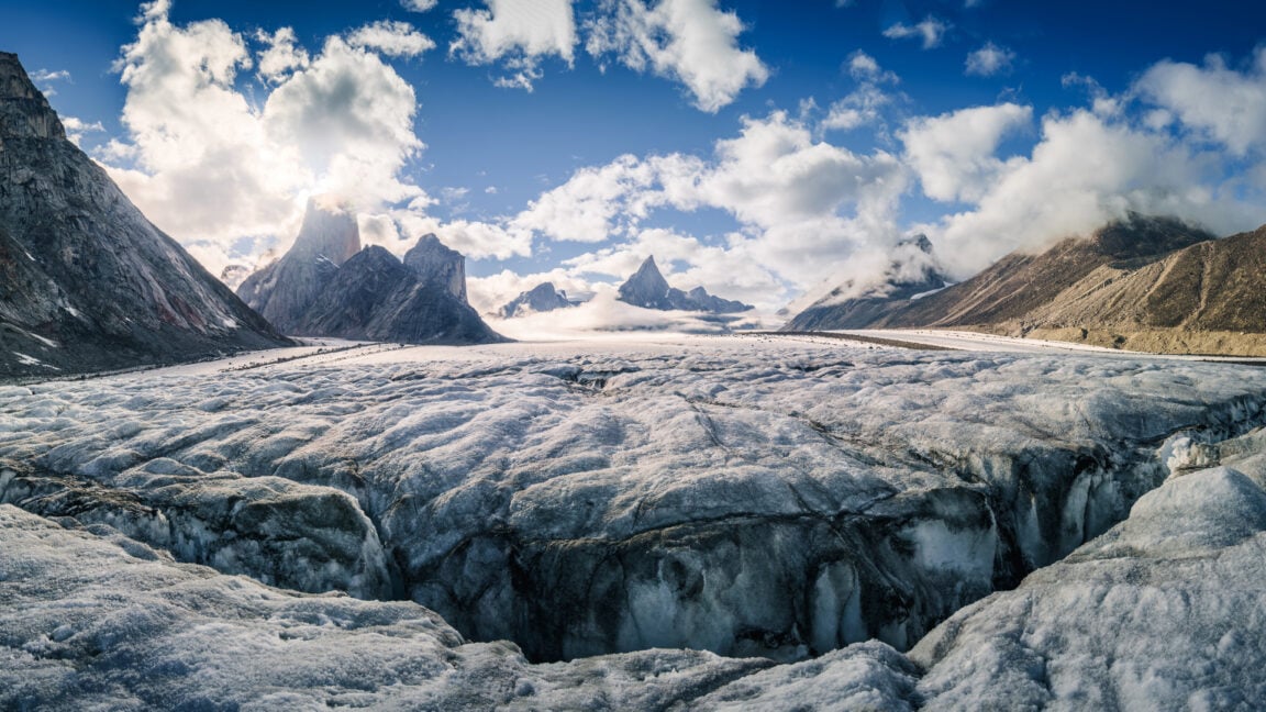 Image of sharp peaks sitting above a large glacier