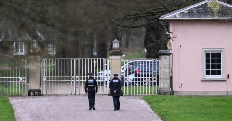 Police officers at the entrance of the Royal Lodge, a property on the estate surrounding Windsor Castle and a former