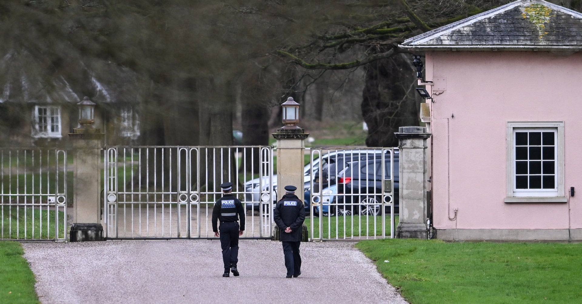 Police officers at the entrance of the Royal Lodge, a property on the estate surrounding Windsor Castle and a former