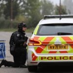 Police officers stand guard as roadblocks remain in place near the RAF Fairford airbase in Gloucestershire. Reuters