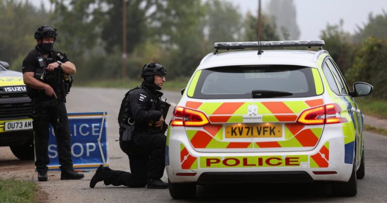 Police officers stand guard as roadblocks remain in place near the RAF Fairford airbase in Gloucestershire. Reuters