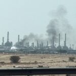 Smoke rises from a fire at the Aramco refinery south of Riyadh, Saudi Arabia, October 3, 2026. Picture taken with a mobile
