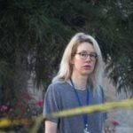 Theranos founder Elizabeth Holmes walks on the grounds of the Federal Prison Camp in Bryan, Texas, U.S., August 3, 2025
