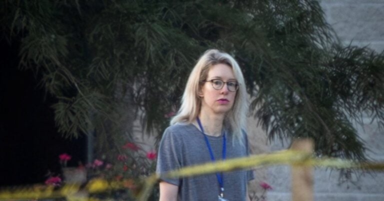 Theranos founder Elizabeth Holmes walks on the grounds of the Federal Prison Camp in Bryan, Texas, U.S., August 3, 2025