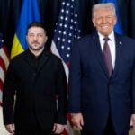 Two politicans pose for a photograph