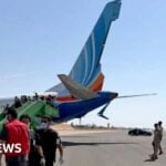 The Flydubai aircraft after its emergency landing appears to show it has sustained damage to its tail fin