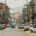 Street traffic with cars and rickshaws in Peshawar, Pakistan